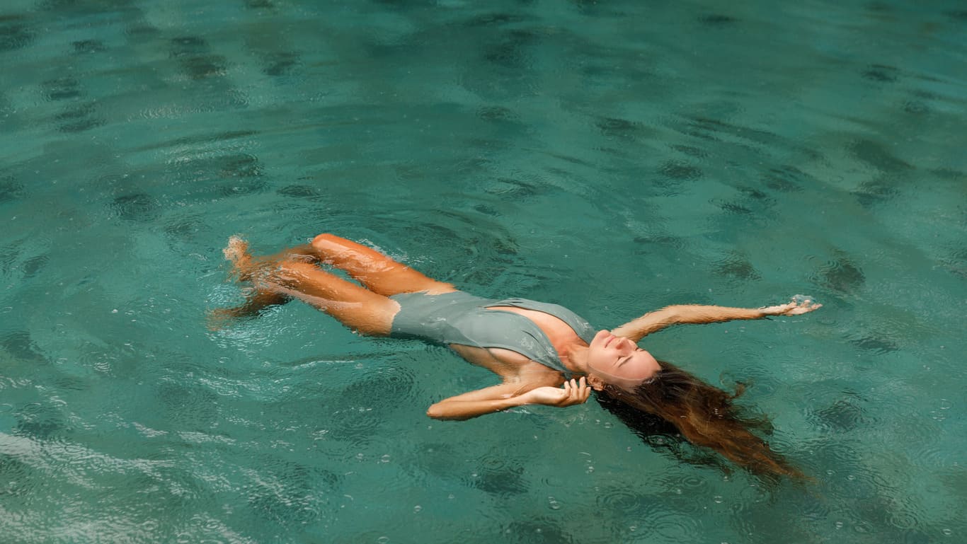 Woman floating in a body of water