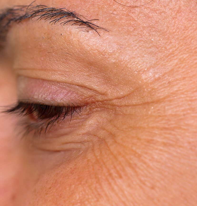 Photo of a close-up on a woman's eye and crow's feet