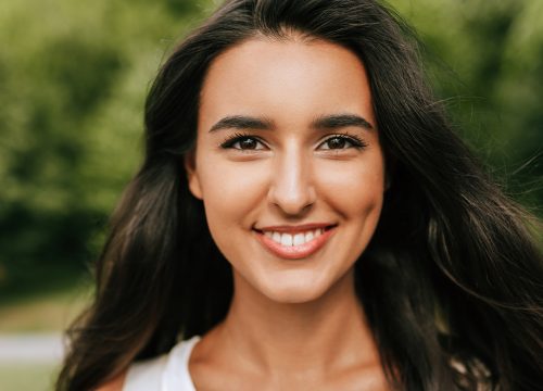 Photo of a smiling young woman with dark hair