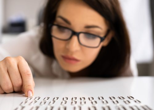 Photo of a woman with OCD lining up paper clips