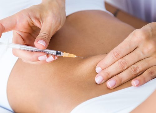 Photo of a woman receiving weight loss injections