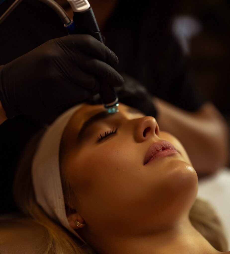 Photo of a woman getting a HydraFacial® treatment at Captivate