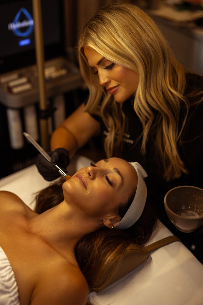 Photo of a woman receiving a chemical peel
