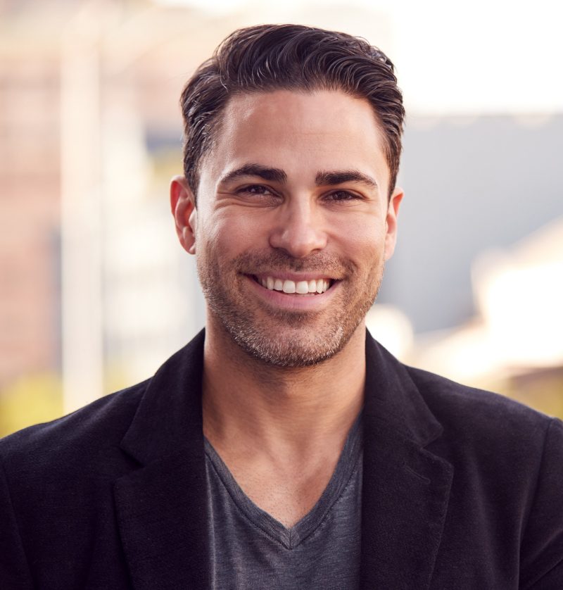 photo of a happy, healthy man wearing a sports coat