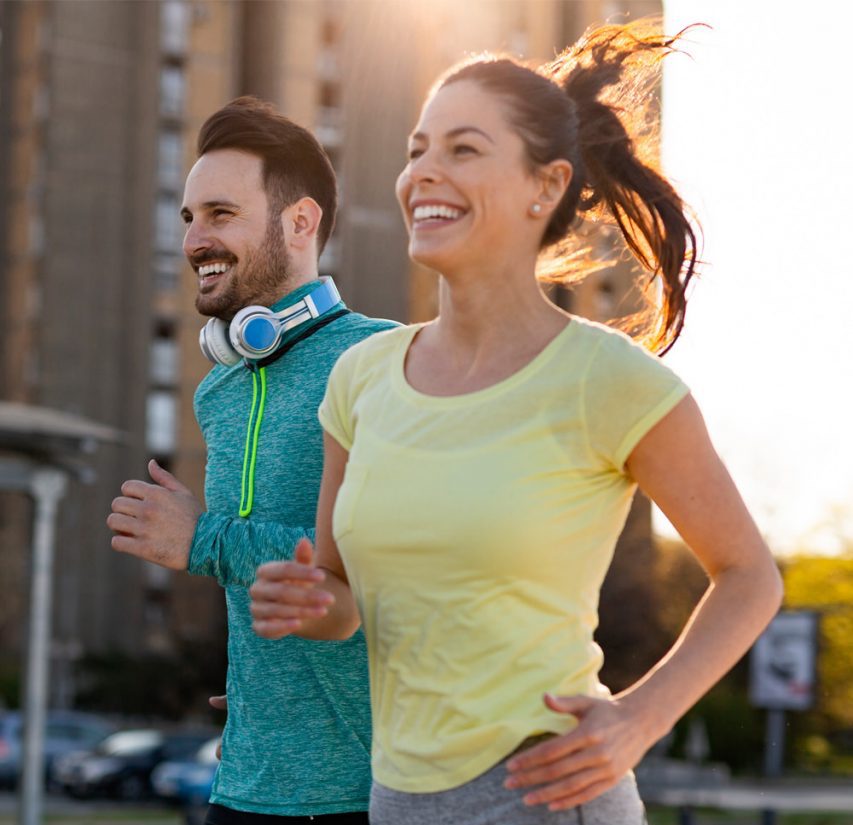 Photo of a woman and a man jogging