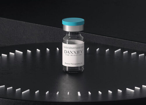 One vial of DAXXIFY on a black background
