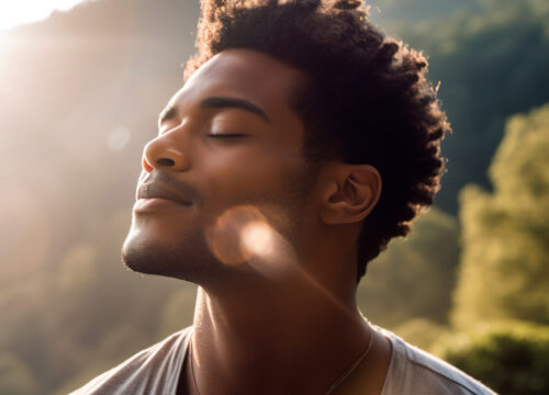 Man outdoors in nature feeling the positive effects of Ketamine and NAD+ Therapy