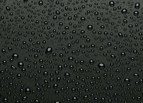 Water droplets dripping on a black background