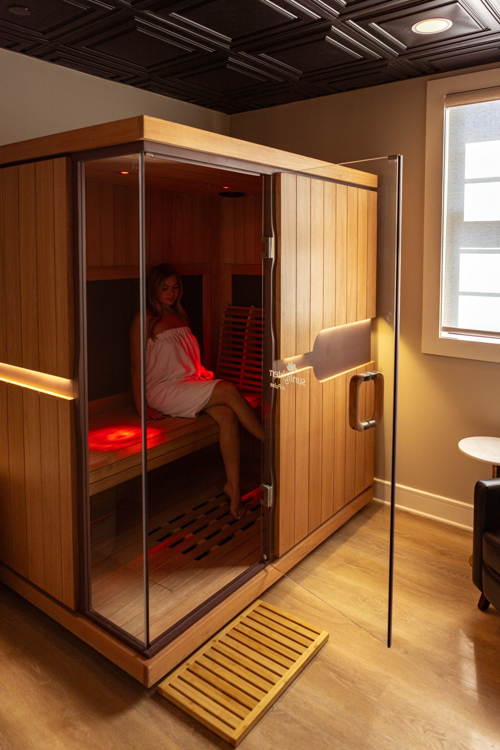 Photo of a woman in the Captivate° Heat Infrared Sauna